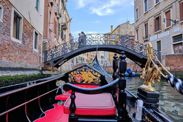 Venice, Italy: View from gondola during the ride through the canals of Venice - obrazy, fototapety, plakaty