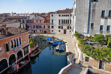 Fototapeta na wymiar Venice: landscape with the image of boats on a channel in Venice, Italy