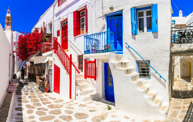 Authentic traditional Greece. Mykonos island. Charming colorful floral streets of old Chora village.  Cyclades