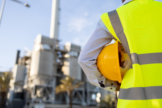 Crop unrecognizable female builder standing on construction site