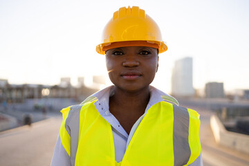 Confident black female builder looking at camera