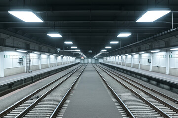 Subway station at night, eerie atmosphere of anticipation and mystery