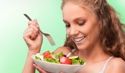 Diet concept, young woman eat vegetables salad