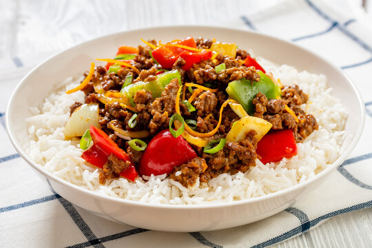 crispy ground beef with stir-fried veggies in bowl