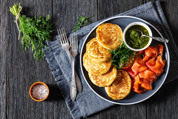 pancakes with sliced cold smoked salmon, top view