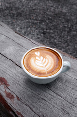 cup of coffee on wooden table