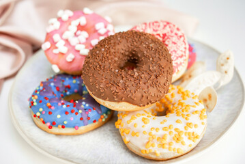 Fresh sweet donuts in colorful glaze