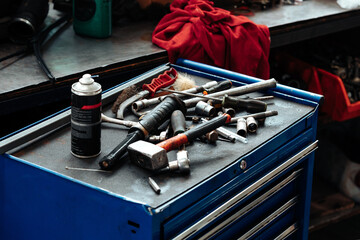 Different tools on workbench in car service