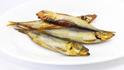 Delicious smoked fish on a white plate