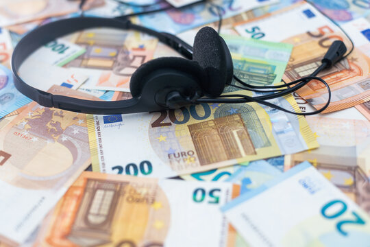 euro banknotes headphones headset. Financial background. Different Euro banknotes. Business, finance, investment, saving and corruption concept.