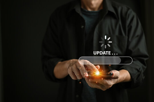Businessman using mobile phone loading data with loading bar icon over a wireless , update concept and business transformation Loading icon on screen.