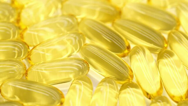 Omega 3 gold fish oil capsules, rotation background, macro. Omega 3 fish oil pills background, vitamin E, A natural capsules texture. Natural supplement close-up. Healthy lifestyle concept. Rotation