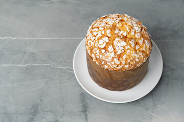 Easter cake with sugar powder on gray background