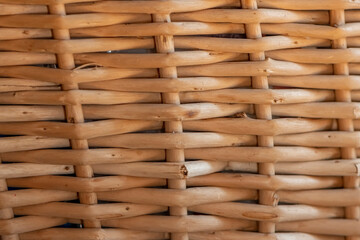 A fragment of a wicker wooden basket made of a vine.