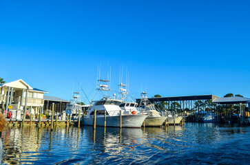 Fototapeta na wymiar Boats Docked in a Marina, Orange Beach, Alabama