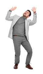 Emotional bearded businessman in suit evading something on white background