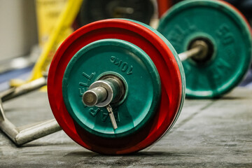 close-up barbell lying on platform, befor deadlift in powerlifting competition
