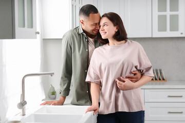 Fototapeta premium Dating agency. Happy couple spending time together in kitchen