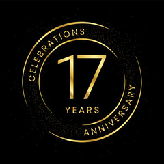 17th anniversary, golden anniversary with a circle, line, and glitter on a black background.