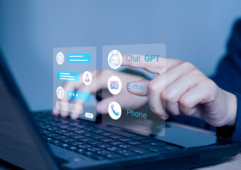 Businesswoman using laptop computer chatting with chat bot, Chat with AI or Artificial Intelligence technology. chatting communication.