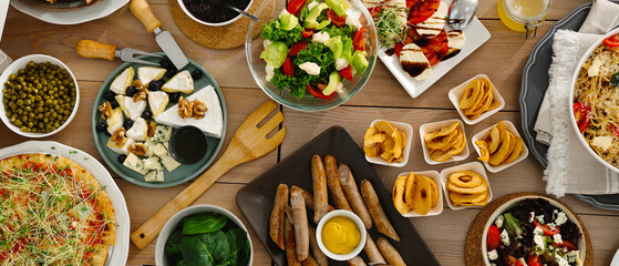 Fototapeta na wymiar Different tasty food for brunch on wooden table, flat lay. Banner design