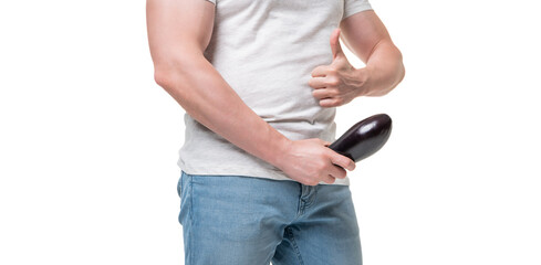 Man crop view giving thumb holding eggplant at crotch level imitating erect penis isolated on white