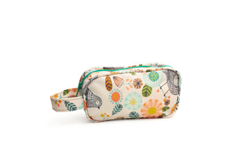 Bolso de mano de colores con motivos florales sobre un fondo blanco liso y aislado. Vista de frente y de cerca. Copy space