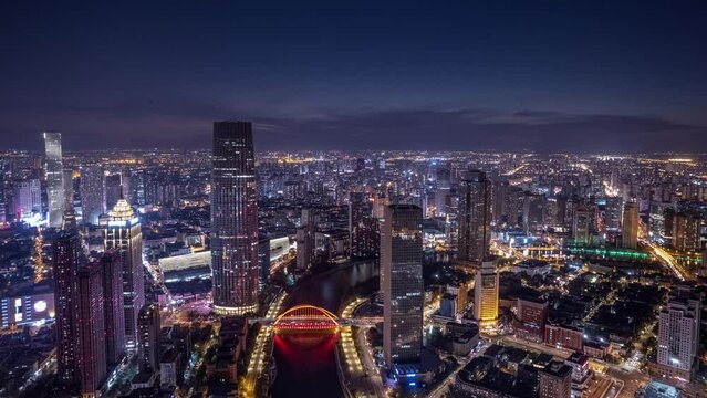 Drone hyper lapse of illuminated modern city at night