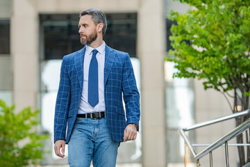 business manager wearing jacket in the street, advertisement.