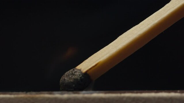 Matchstick match with fire macro close up, probe lens firing, smoking.