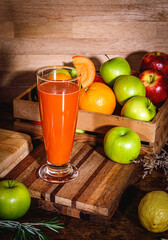 Carrot fresh juice in glass. freshly squeezed juice, fruit and vegetable smoothies.