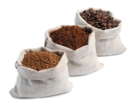 Bags with different types of coffee on white background