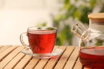 Delicious hibiscus tea on wooden table indoors