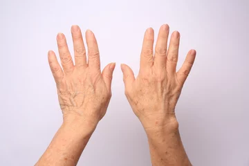 Foto op Plexiglas Oude deur Closeup view of older woman's hands on white background