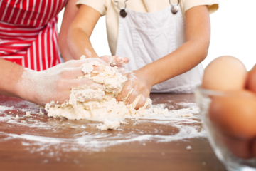 Portrait of adorable little girl and her mother baking together