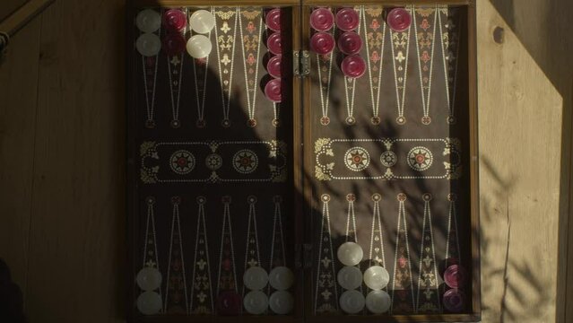 time lapse of an entire backgammon game where red wins, 4k footage, top shot.