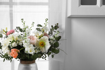 Beautiful bouquet of different fresh flowers indoors, closeup. Space for text