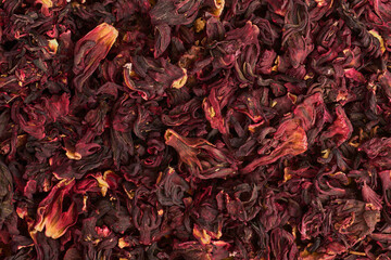 Flowers of hibiscus, dry carcade tea close up, background