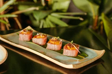 Gordijnen A plate with sushi and a blurred background © Jonathan Borba/Wirestock Creators