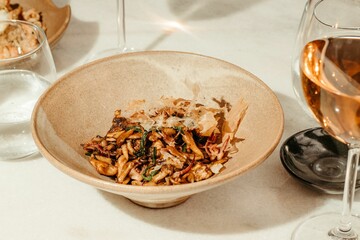 a bowl full of cooked meat and vegetables