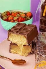 A vertical shot of a big chocolate bar with a filling