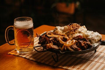 Close-up image of a well-worn iron skillet filled with hearty comfort food
