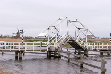 Wooden bridge across a canal in Kinderdijk. Holland