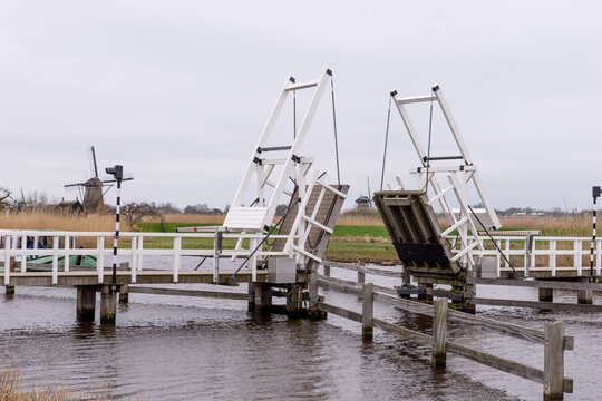 Wooden bridge across a canal in Kinderdijk. Holland