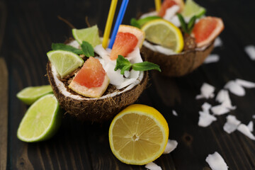 healthy coconut ice cream with citrus fruits, lime, lemon and grapefruit in a coconut shell. for banners, leaflets, postcards, napkins, coasters, labels, etc.
