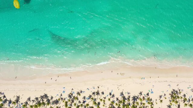 Pristine and bounty shore. Arena Gorda beach with resorts. People faving fun on caribbean coastline. Aerial view from drone
