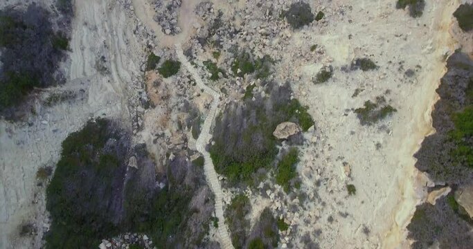 Drone view over the mountainside road leading to the sea