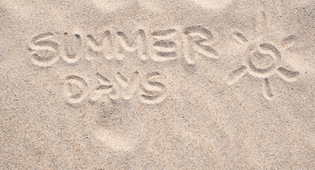 Fototapeta na wymiar Sand background. Text Summer Days written on sand. Sandy beach. Blank negative space for copy. Summer holiday banner.