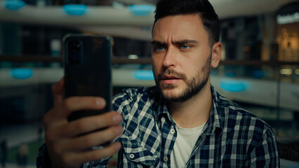 Millennial blogger caucasian hispanic man businessman business consultant speak mobile phone via...