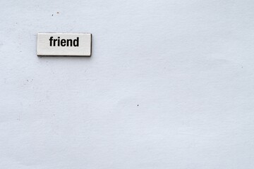 The word "friend" on a white background wrote with fridge magnet